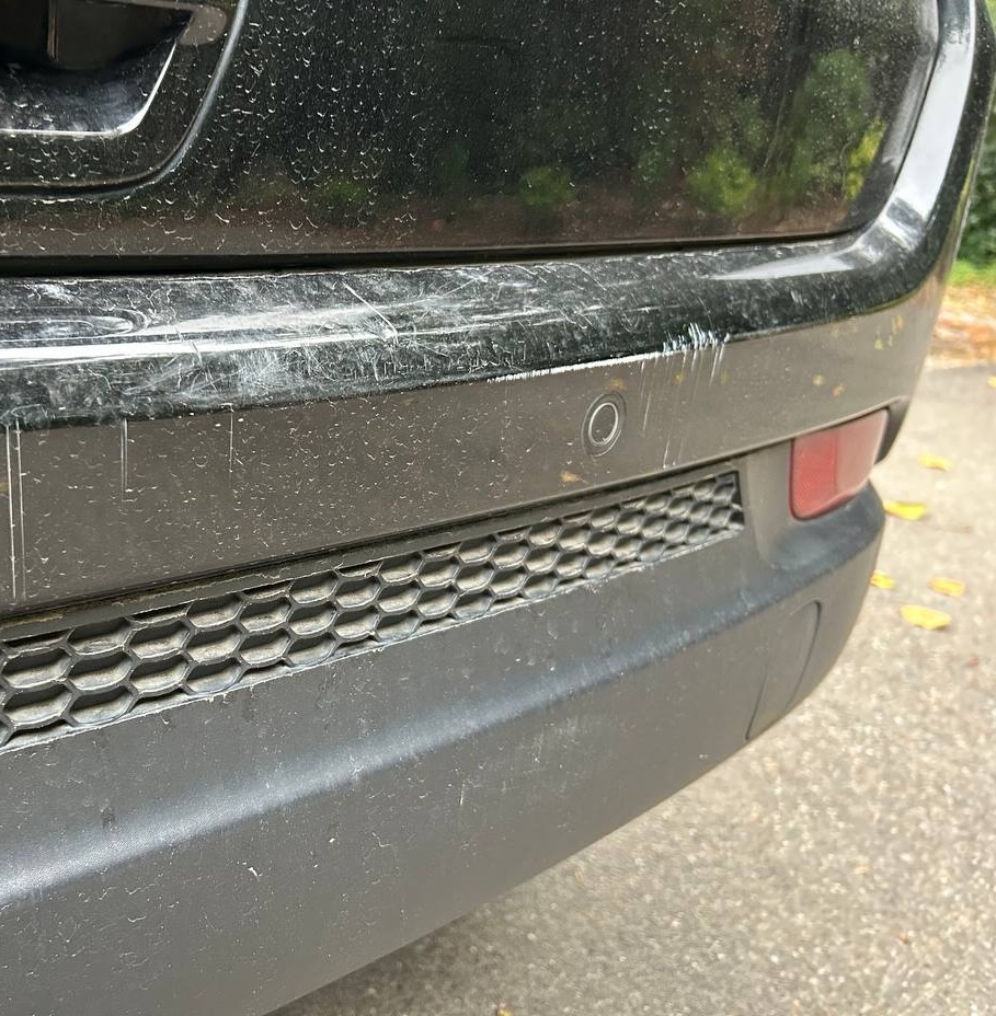 Vehicle paint before correction, with visible surface haze and marks